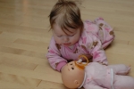 Our little dolly, playing with her little dolly!