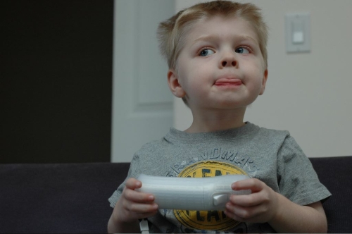 Gamer face! Of all the fancy new games around, our guys love the old Super Mario Bros. 3 for NES. 