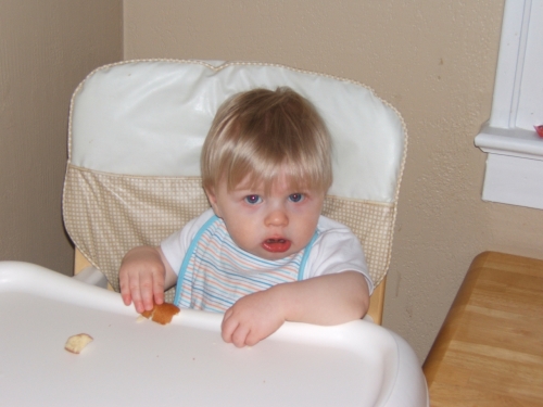 Do you  mind? I'm busy having a piece of Dad's donut.