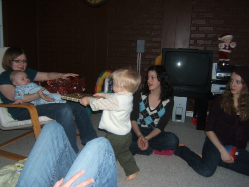 Santa passing out the presents.