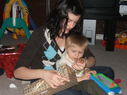 Auntie Robyn helping open some presents.