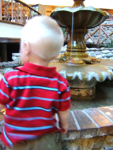 Playing in the fountain.