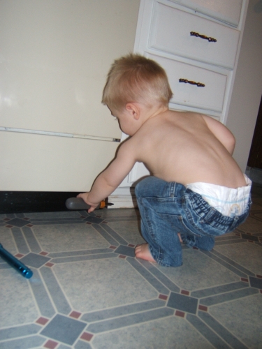 Fixing the dishwasher, just like Pappy and Daddy.