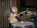 Our little lion drumming away.